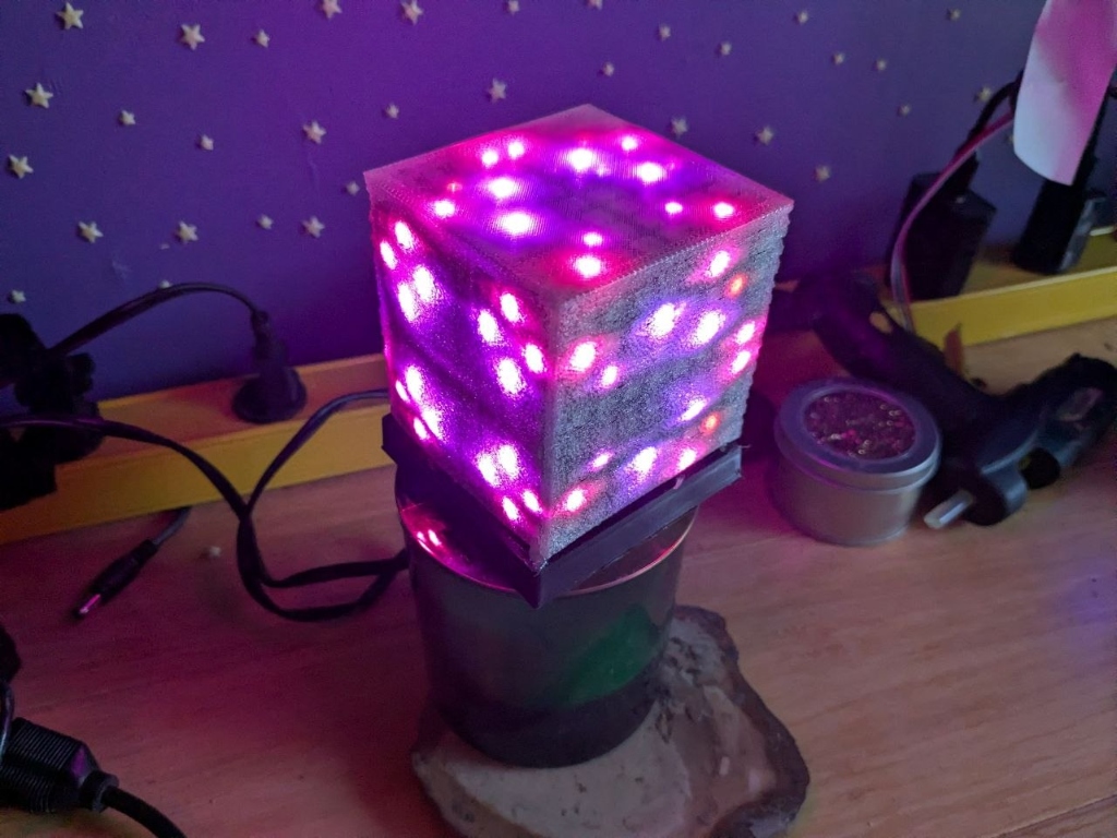 Hypercube Lit with Sound-Reactive Ripple Patterns